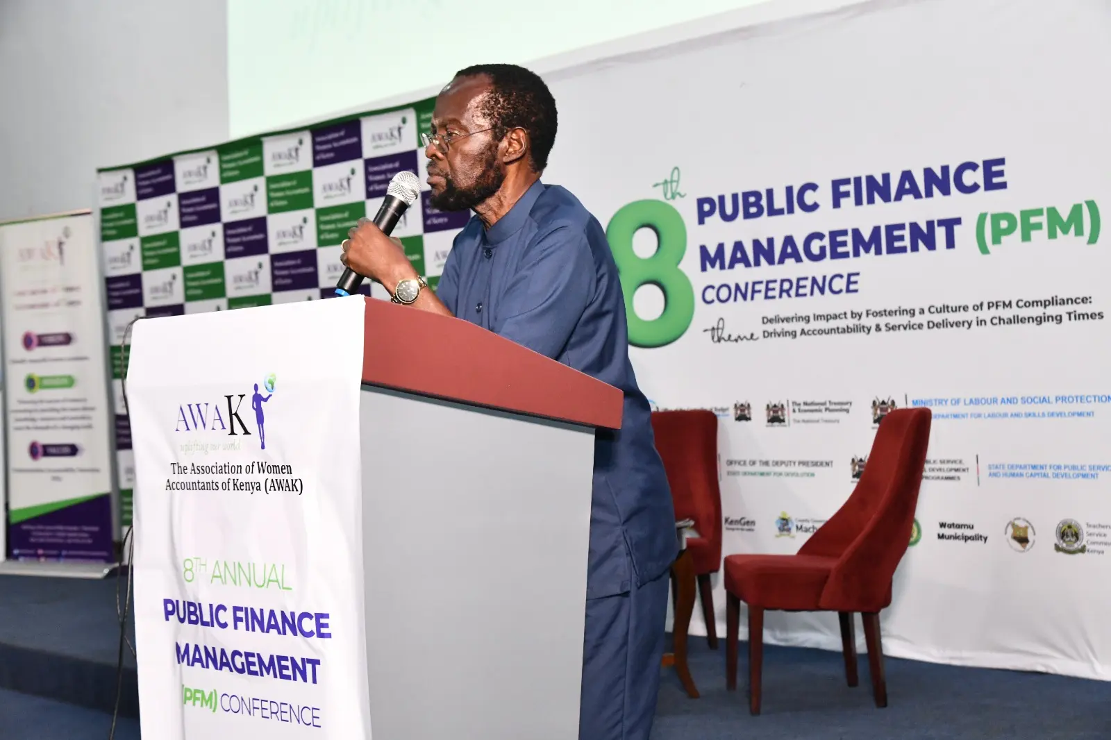 Public finance leader addressing the AWAK PFM Conference